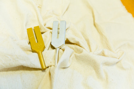 Close up of cutlery on a white fabric with copy spaceの写真素材