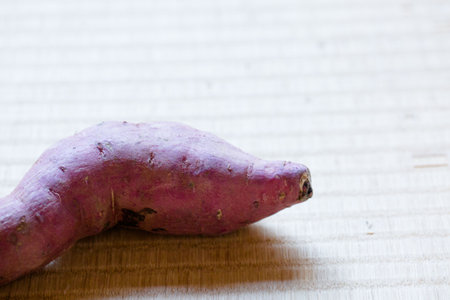 Sweet potato on the table. Shallow depth of field. Selective focus.の写真素材