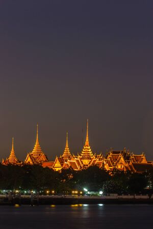 Golden light of the temple of the Emerald Buddha in Bangkok Thailandの写真素材