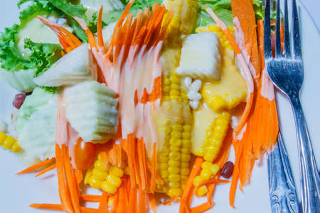 Healthy vegetable salad in a white dish の写真素材