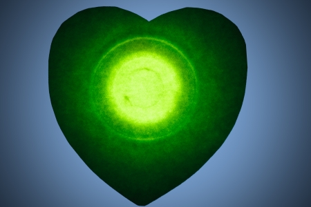 Green heart in the middle with a light heart の写真素材