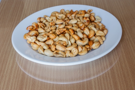 Cashew fried white dish on the table の写真素材