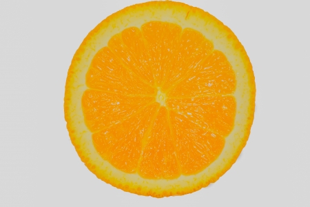 Macro orange slice with a white background.の写真素材