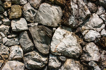 Background on the surface of the stone wall の写真素材