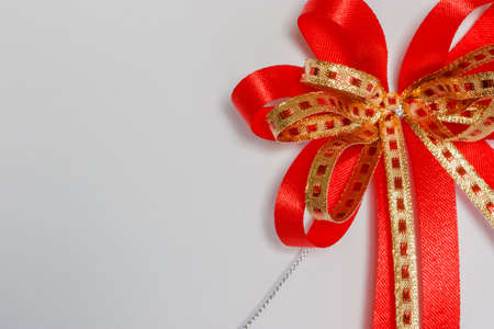 Red bow on a white background の写真素材