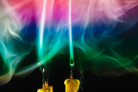 Smoke from the candles on colorful.の写真素材