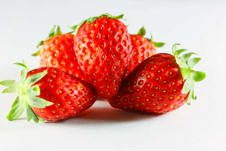 Fruit strawberry bright red to eat on white background の写真素材
