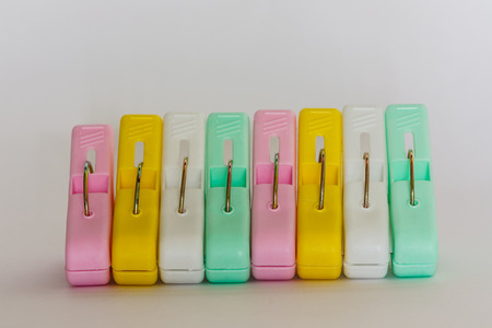 Plastic clothes pin on white background.の写真素材