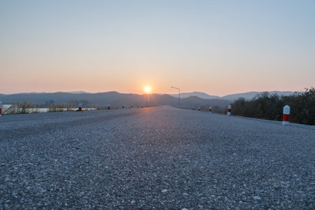 Empty Road With a sunrise in the morningの写真素材