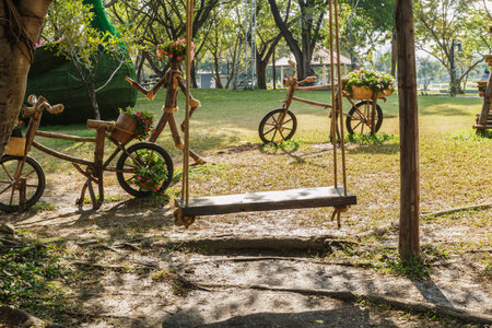 Outdoor Gardening ideas with swing wood and wooden bike