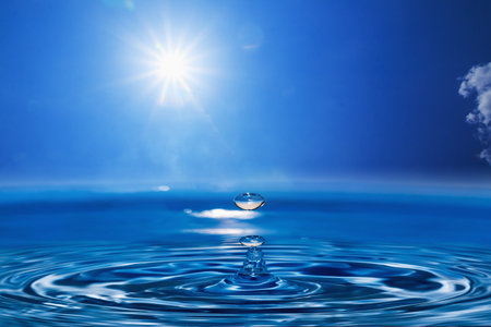 Water drops with  Sun and blue sky