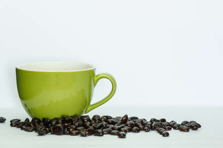 Coffee cup green and beans on a white background.の写真素材