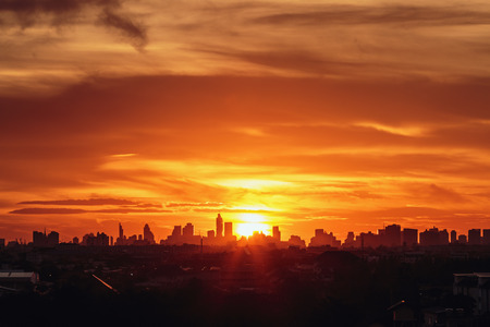 Sunset at city of Bangkok with  building silhouetteの写真素材