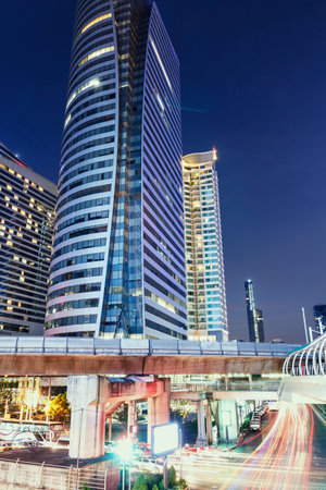 Bangkok at night from autos lightsbusiness area in thailand