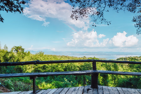 Blue sky with white clouds. With planks benches