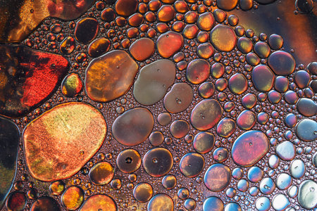 Close up oil floating on water  surface used as backgroundの写真素材