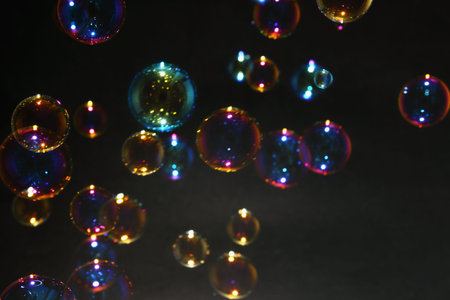 Blurred colorful bubbles from the soap bubbles on background