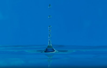 Water droplets  higher on  blue background