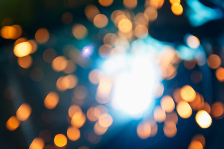 Light blurred background from welding steel with sparks and smoke