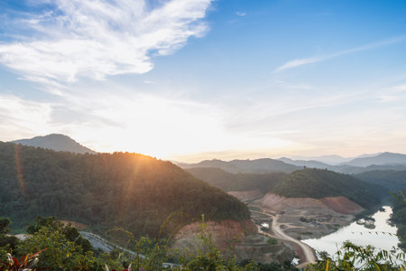 Last light of sun on the mountains forest nature in countrysideの写真素材