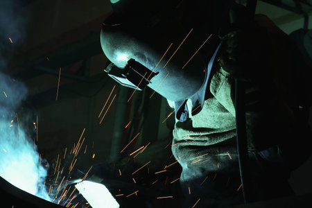 Welder of Metal Welding with sparks and smokeの写真素材