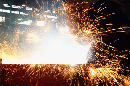 Sparks and smoke from Gouging carbon in industrial