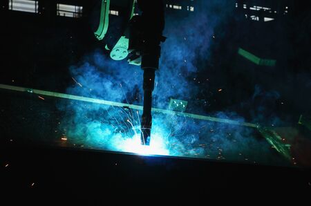 Robots used Metal Welding with sparks and smoke in  heavy industryの写真素材