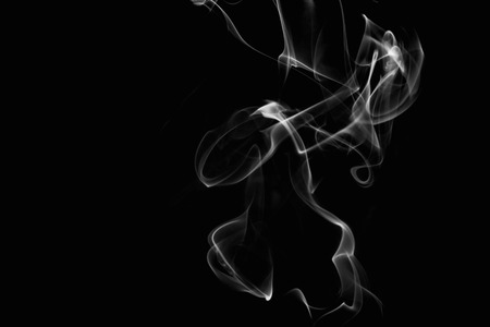 White smoke on black backgroundの写真素材