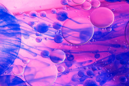 oil and slough on water surface with pink blue background