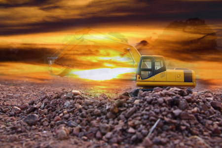Excavator loader model with light of sunset  background,Concept Double exposure
