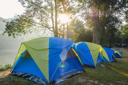 Camping tent in the lawn with sunlight morning  of forest ,In national parkの写真素材