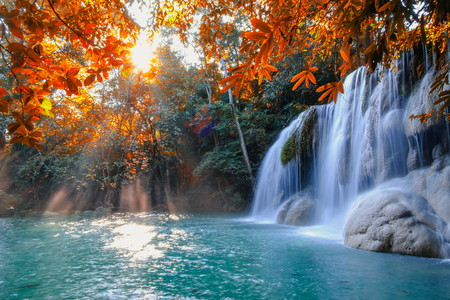 Scenic of nature Beautiful Waterfall with sunlight in autumn forest at Erawan  National Park, Thailand ,Travel amazing asiaの写真素材