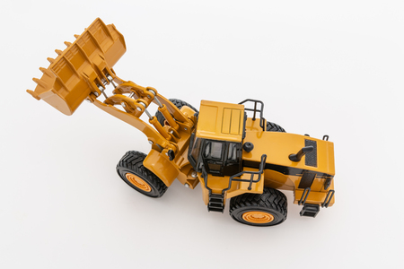Yellow wheel loader   on  a whiteの写真素材