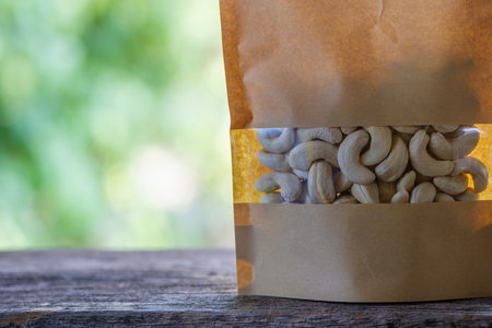 Cashew nuts the packaging bag on  floor wooden old with natureの写真素材