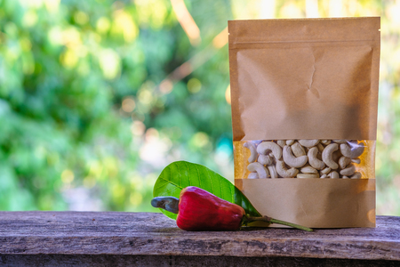Cashew nuts and fruit the packaging bag on  floor wooden old with natureの写真素材