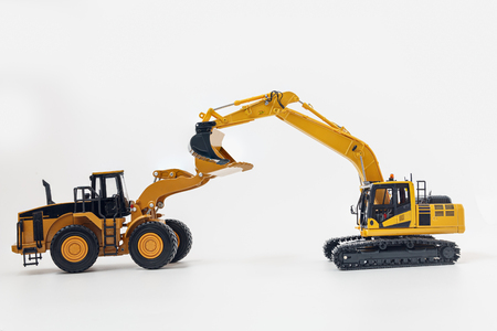 Excavator and Wheel loader model isolated on white  in industrial constructionの写真素材