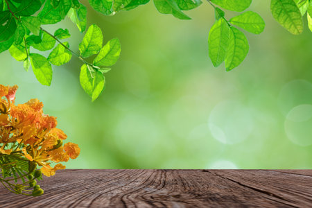 Empty old wooden on a bokeh  with leaves and flowers, selective focus of product display template