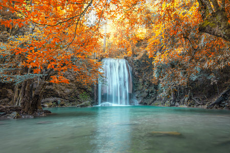 Scenic of nature with Beautiful Waterfall  in autumn forest at Erawan  National Park, Thailand