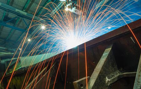 Welding Sparks and smoke  from robot  in manufacturing  of industryの写真素材