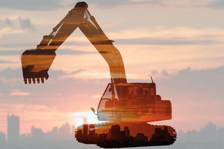 Double exposure concept of excavator loader  on  cityscapes  with silhouette buildingの写真素材