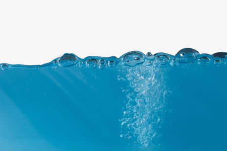 Air bubbles of mineral water on white