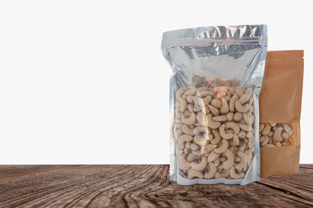 Cashew nut In the packaging bag on wooden with  a whiteの写真素材