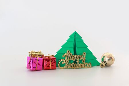 Paper christmas tree ,with  ball and gift,ornament on white background,Copy spaceの写真素材