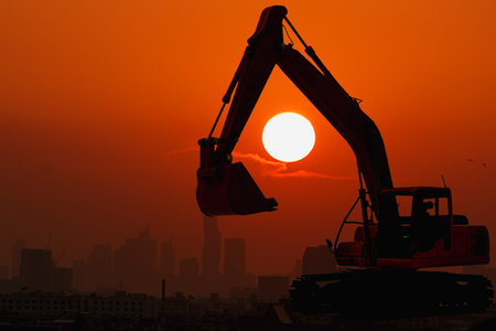 Excavator loader of silhouette with sunset background,In city with building