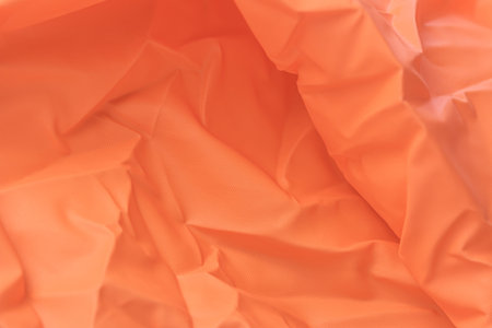Macro photography,Texture abstract of bright orange fabric used as background