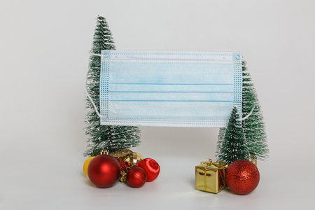 Medical mask with ornaments  on white background, virus protection ,The concept of health care in the Christmas Festivalの写真素材