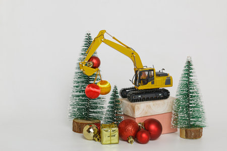 Christmas ornament with Excavator model ,  Holiday celebration concept new year on white backgroundの写真素材