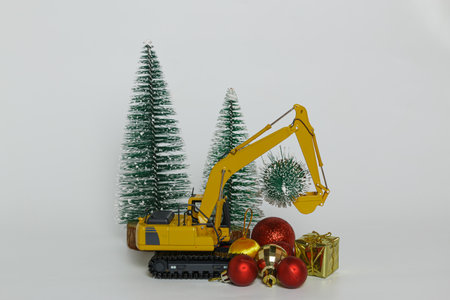 Christmas ornament with Excavator model ,  Holiday celebration concept new year on white backgroundの写真素材