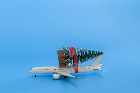Christmas tree on toy airplane model. Festival  holiday celebration concept