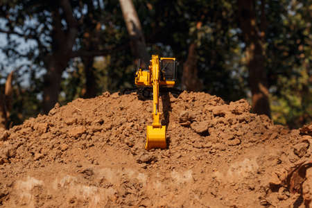 Excavators loader are digging the soil in the construction siteの写真素材